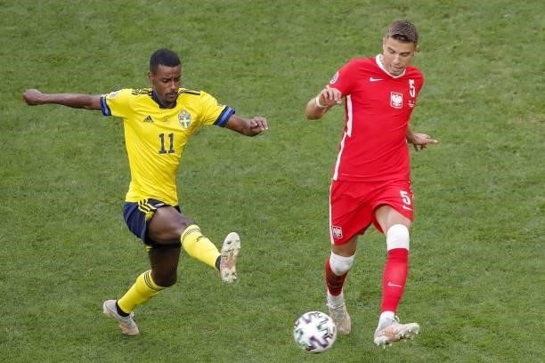 Sweden's forward Alexander Isak fights for the ball with Poland's defender Jan Bednarek during the UEFA EURO 2020 Group E football match between...