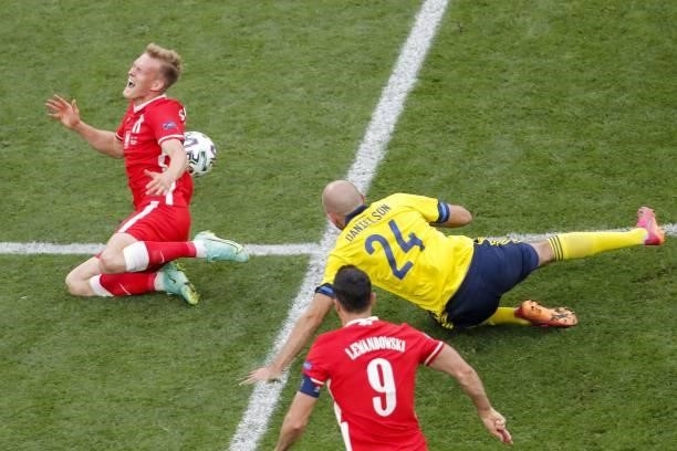 Sweden's defender Marcus Danielsson fouls Poland's forward Karol Swiderski leading to a yellow card during the UEFA EURO 2020 Group E football match...