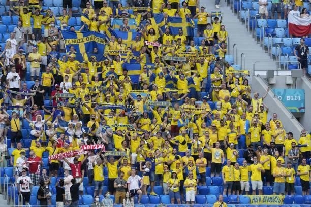 Sweden supporters hold scarves before the UEFA EURO 2020 Group E football match between Sweden and Poland at Saint Petersburg Stadium in Saint...