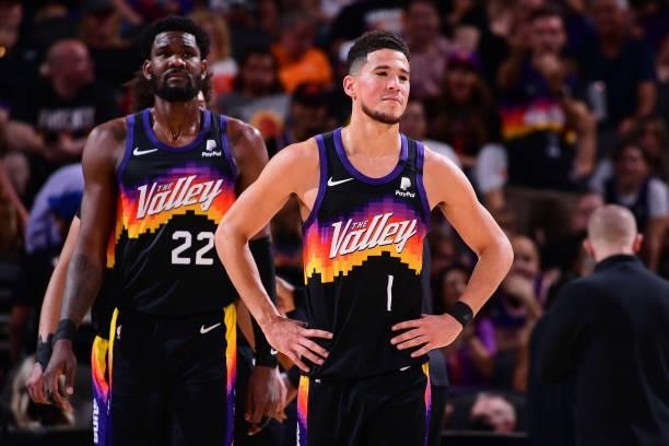 Deandre Ayton and Devin Booker of the Phoenix Suns look on during Game 2 of the Western Conference Finals of the 2021 NBA Playoffs on June 22, 2021...