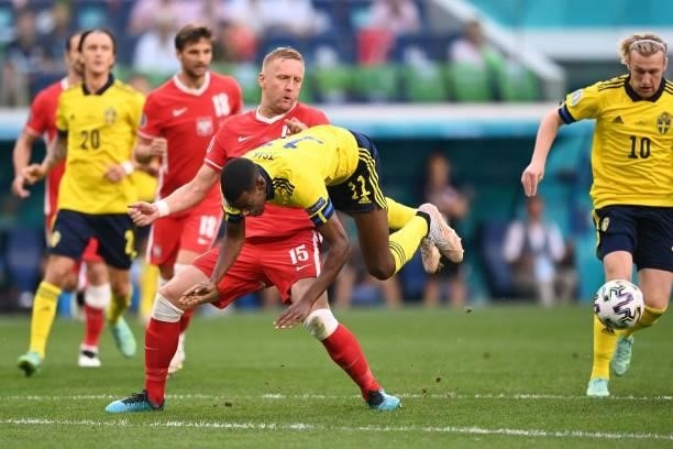 Poland's defender Kamil Glik fights for the ball with Sweden's forward Alexander Isak during the UEFA EURO 2020 Group E football match between Sweden...