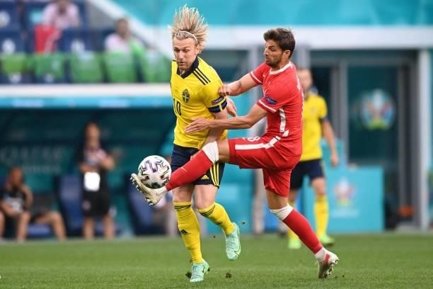 Sweden's midfielder Emil Forsberg fights for the ball with Poland's defender Bartosz Bereszynski during the UEFA EURO 2020 Group E football match...