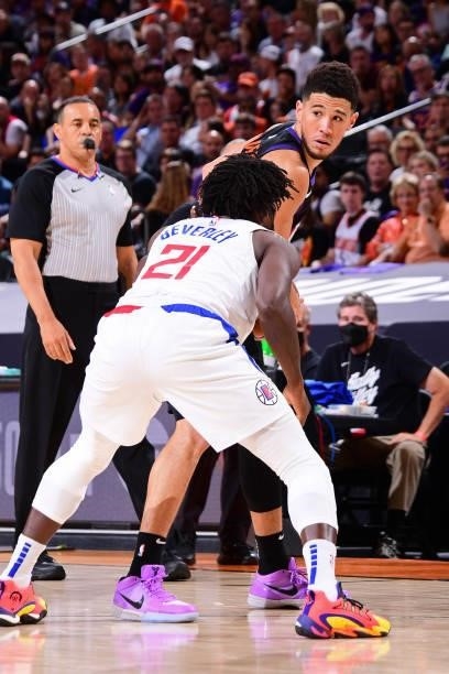 Patrick Beverley of the LA Clippers plays defense on Devin Booker of the Phoenix Suns during Game 2 of the Western Conference Finals of the 2021 NBA...