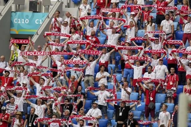 Poland supporters hold scarves before the UEFA EURO 2020 Group E football match between Sweden and Poland at Saint Petersburg Stadium in Saint...