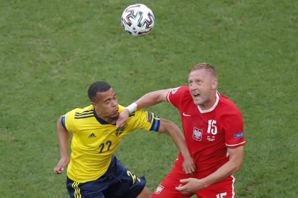 Sweden's midfielder Robin Quaison fights for the ball with Poland's defender Kamil Glik during the UEFA EURO 2020 Group E football match between...