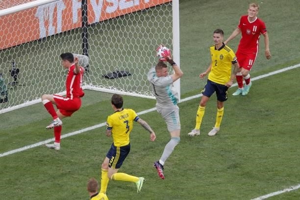 Sweden's goalkeeper Robin Olsen catches the ball during the UEFA EURO 2020 Group E football match between Sweden and Poland at Saint Petersburg...