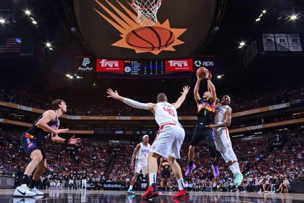 Devin Booker of the Phoenix Suns drives to the basket drives to the basket against the LA Clippers during Game 2 of the Western Conference Finals of...