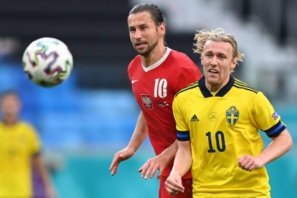 Sweden's midfielder Emil Forsberg fights for the ball with Poland's midfielder Grzegorz Krychowiak during the UEFA EURO 2020 Group E football match...
