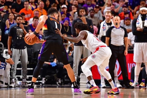 Patrick Beverley of the LA Clippers plays defense on Devin Booker of the Phoenix Suns during Game 2 of the Western Conference Finals of the 2021 NBA...