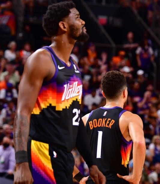 Devin Booker and Deandre Ayton of the Phoenix Suns look on during Game 2 of the Western Conference Finals of the 2021 NBA Playoffs on June 22, 2021...