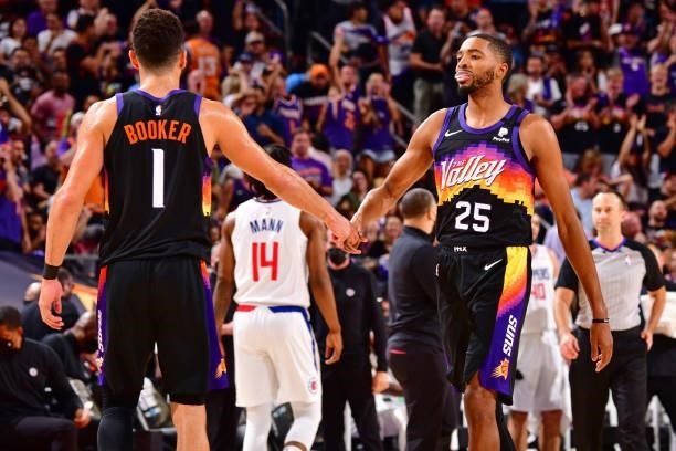 Devin Booker and Mikal Bridges of the Phoenix Suns embrace during Game 2 of the Western Conference Finals of the 2021 NBA Playoffs on June 22, 2021...