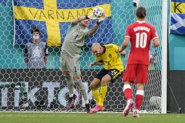 Sweden's goalkeeper Robin Olsen catches the ball during the UEFA EURO 2020 Group E football match between Sweden and Poland at Saint Petersburg...