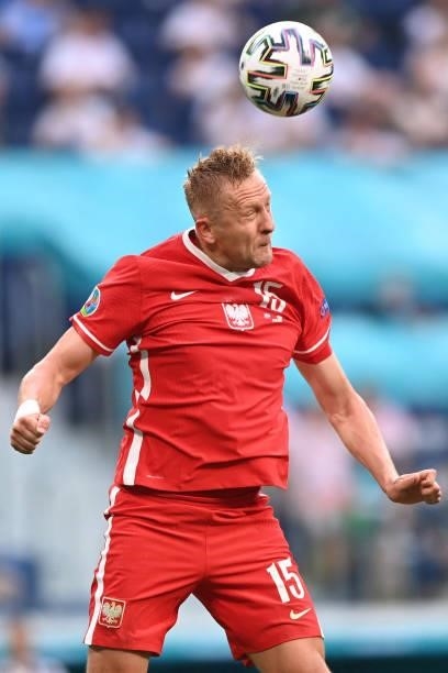 Poland's defender Kamil Glik heads the ball during the UEFA EURO 2020 Group E football match between Sweden and Poland at Saint Petersburg Stadium in...