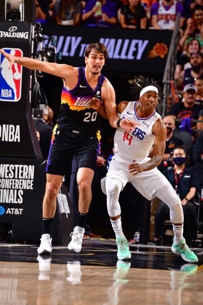Terance Mann of the LA Clippers and Dario Saric of the Phoenix Suns fight for position during Game 2 of the Western Conference Finals of the 2021 NBA...