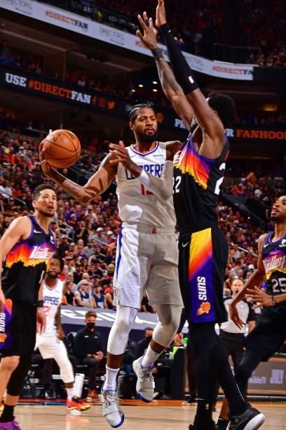 Paul George of the LA Clippers drives to the basket and looks to pass the ball against the Phoenix Suns during Game 2 of the Western Conference...