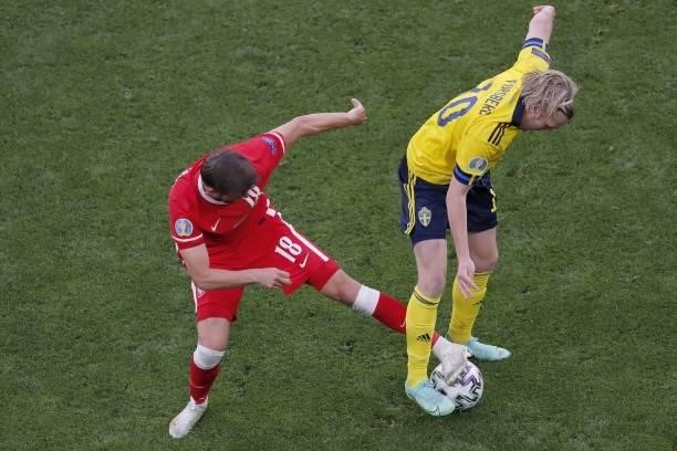 Poland's defender Bartosz Bereszynski fights for the ball with Sweden's midfielder Emil Forsberg during the UEFA EURO 2020 Group E football match...