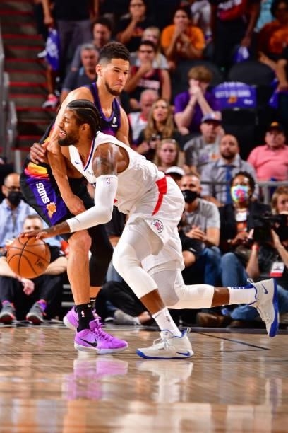 Devin Booker of the Phoenix Suns plays defense on Terance Mann of the LA Clippers during Game 2 of the Western Conference Finals of the 2021 NBA...