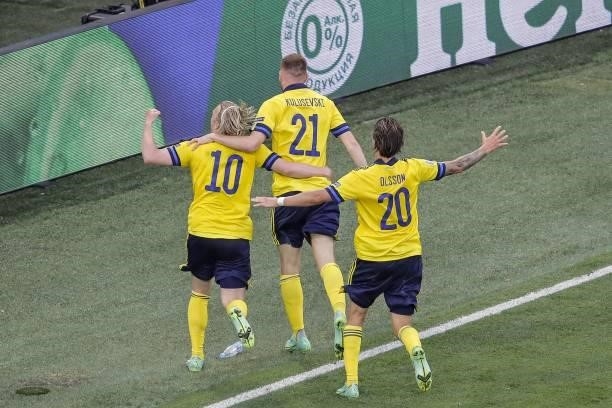 Sweden's midfielder Emil Forsberg celebrates with Sweden's midfielder Dejan Kulusevski and Sweden's midfielder Kristoffer Olsson R after scoring his...