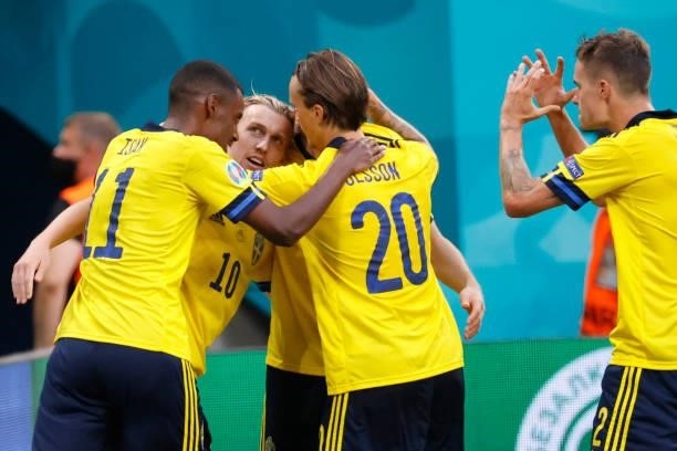 Sweden's midfielder Emil Forsberg celebrates with teammates after scoring his team's second goal during the UEFA EURO 2020 Group E football match...