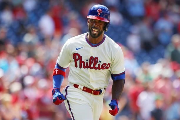 Andrew McCutchen of the Philadelphia Phillies reacts after he hit a pinch-hit grand slam home run against the Washington Nationals during the fifth...