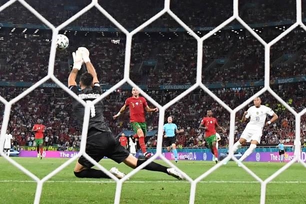 Portugal's goalkeeper Rui Patricio makes a save during the UEFA EURO 2020 Group F football match between Portugal and France at Puskas Arena in...