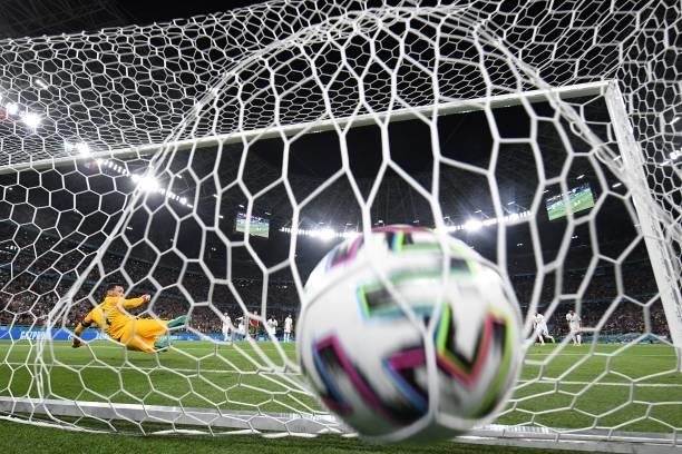 France's goalkeeper Hugo Lloris concedes the opening goal scored by Portugal's forward Cristiano Ronaldo from the penalty spot during the UEFA EURO...