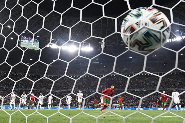 Portugal's forward Cristiano Ronaldo scores the opening goal from the penalty spot during the UEFA EURO 2020 Group F football match between Portugal...