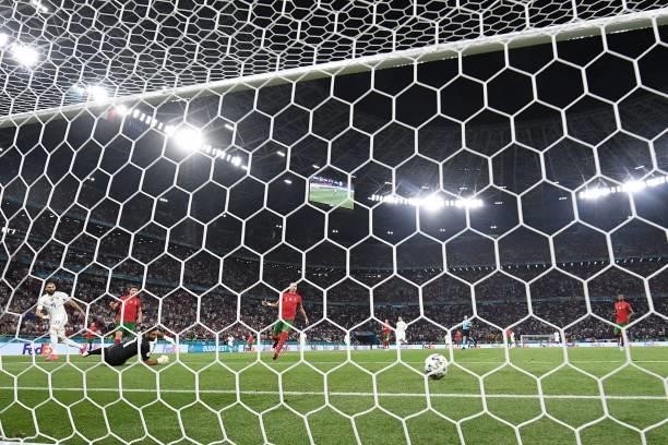 France's forward Karim Benzema scores the team's second goal during the UEFA EURO 2020 Group F football match between Portugal and France at Puskas...