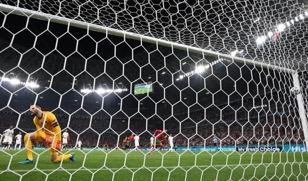 Portugal's forward Cristiano Ronaldo scores the team's second goal from the penalty spot past France's goalkeeper Hugo Lloris during the UEFA EURO...