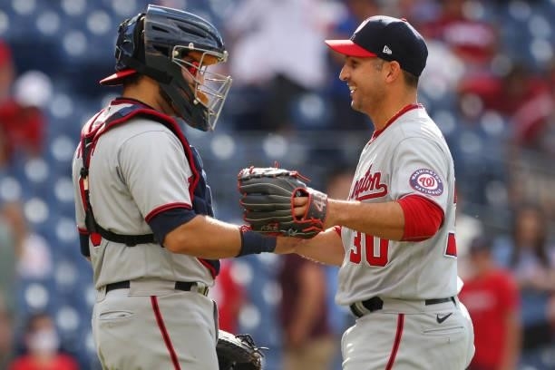 Catcher Alex Avila congratulates pitcher Paolo Espino of the Washington Nationals after getting the final out in the ninth inning against the...