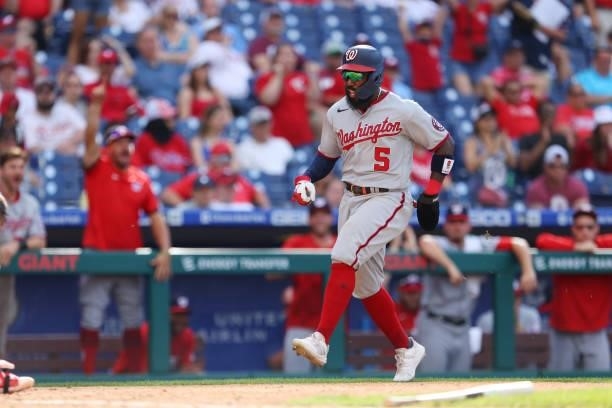 Josh Harrison of the Washington Nationals scores on a two run single by Starlin Castro against the Philadelphia Phillies during the ninth inning of a...