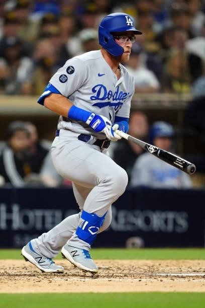 Matt Beaty of the Los Angeles Dodgers bats in a run during the game between the Los Angeles Dodgers and the San Diego Padres at Petco Park on...