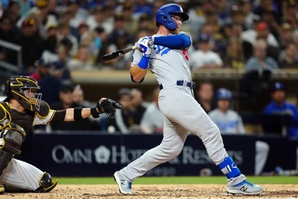 Matt Beaty of the Los Angeles Dodgers bats in a run during the game between the Los Angeles Dodgers and the San Diego Padres at Petco Park on...