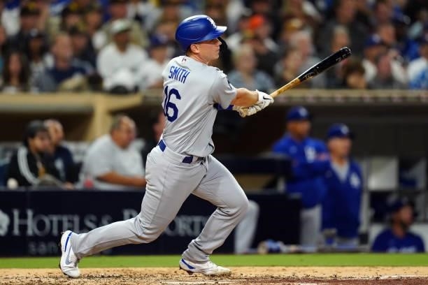 Will Smith of the Los Angeles Dodgers hits an RBI single during the game between the Los Angeles Dodgers and the San Diego Padres at Petco Park on...