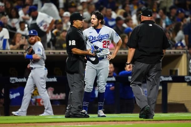 Umpires check the equipment of Trevor Bauer of the Los Angeles Dodgers for foreign substances during the game between the Los Angeles Dodgers and the...