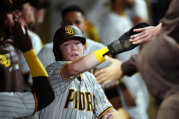 Jake Cronenworth of the San Diego Padres celebrates scoring the go-ahead run during the game between the Los Angeles Dodgers and the San Diego Padres...