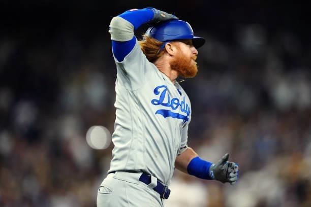 Justin Turner of the Los Angeles Dodgers hits an RBI single to tie the game during the game between the Los Angeles Dodgers and the San Diego Padres...
