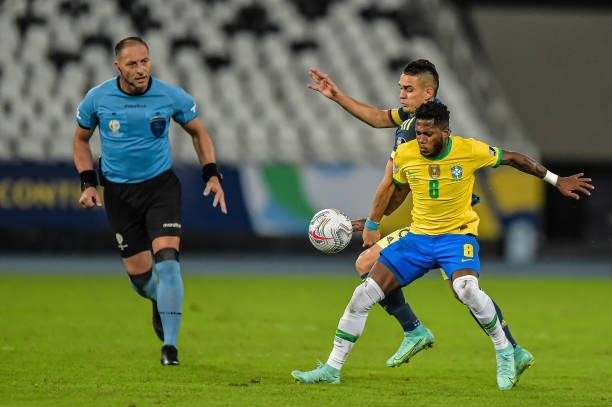 Fred player from Brazil disputes a bid with Barrios player from Colombia during the Group B match between Brazil and Colombia as part of Copa America...