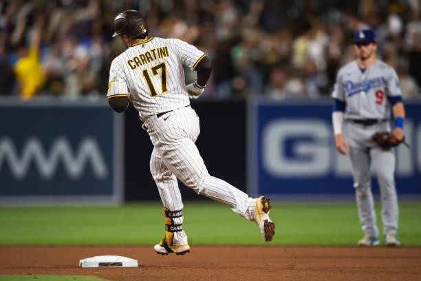 Victor Caratini of the San Diego Padres jogs around the bases after hitting a home run in the seventh inning against the Los Angeles Dodgers on June...