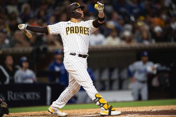 Victor Caratini of the San Diego Padres hits a home run in the seventh inning against the Los Angeles Dodgers on June 23, 2021 at Petco Park in San...