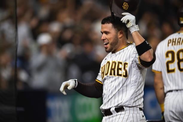 Victor Caratini of the San Diego Padres smiles after hitting a home run in the seventh inning against the Los Angeles Dodgers on June 23, 2021 at...