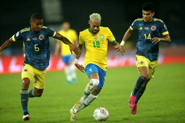 Neymar Jr of Brazil competes for the ball with Wilmar Barrios and Luis Diaz of Colombia during the match between Brazil and Colombia as part of...