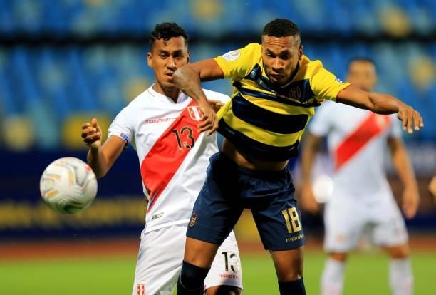 Ayrton Preciado of Ecuador competes for the ball with Renato Tapia of Peru during the match between Colombia and Peru as part of Conmebol Copa...