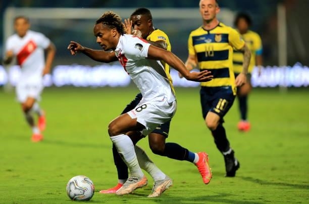 Andre Carrillo of Peru competes for the ball with Jhegson Mendez of Ecuador ,during the match between Colombia and Peru as part of Conmebol Copa...