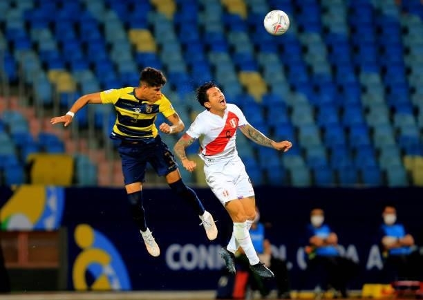 Piero Hincapie of Ecuador head the ball against Gianluca Lapadula of Peru ,during the match between Colombia and Peru as part of Conmebol Copa...