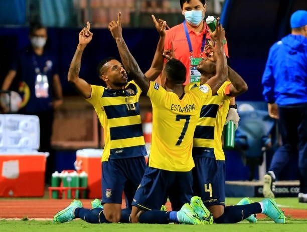 Ayrton Preciado of Ecuador celebrates with his teammates Robert Arboleda and Pervis Estupinan after scoring a goal during the match between Colombia...