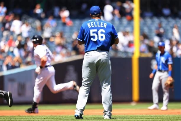 Luke Voit of the New York Yankees circles the bases after hitting a home run as pitcher Brad Keller the Kansas City Royals looks on during the third...