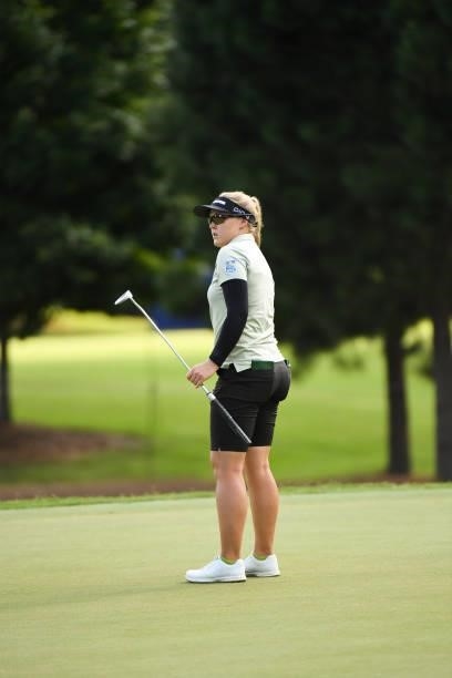 Brooke Henderson of Canada watches her putt on the seventh hole during the first round for the 2021 KPMG Women's Championship at the Atlanta Athletic...