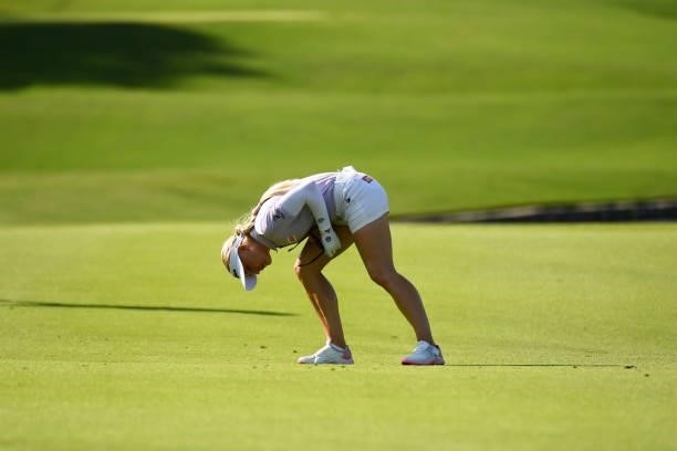 Charley Hull of England identifies her ball on the eighth hole during the first round for the 2021 KPMG Women's Championship at the Atlanta Athletic...