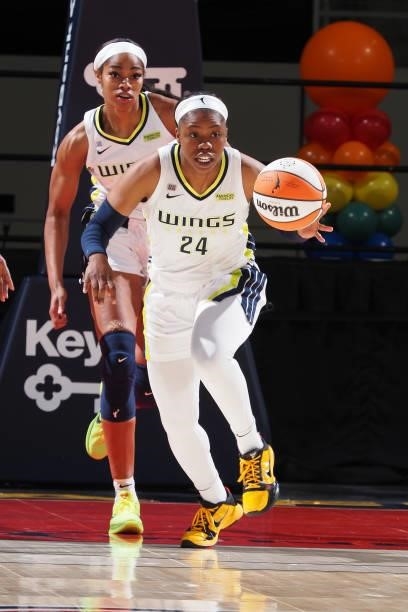 Arike Ogunbowale of the Dallas Wings dribbles the ball against the Indiana Fever on June 24, 2021 at Indiana Farmers Coliseum in Indianapolis,...